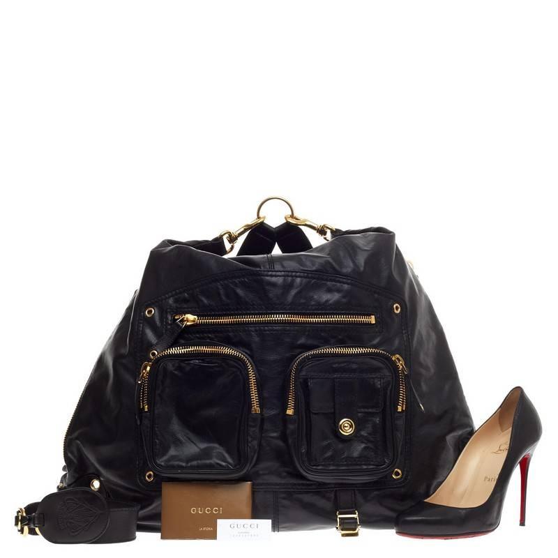 This authentic Gucci Darwin Convertible Backpack Leather Large released in the brand's 2009 Collection is a casual-cool, utilitarian everyday accessory for the on-the-go woman. Crafted from supple black leather, this convertible backpack features