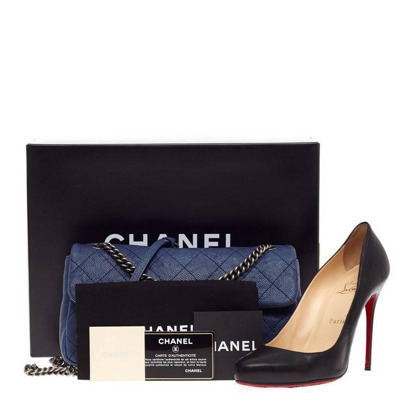 This authentic Chanel Simply CC Flap Quilted Caviar Medium is a must-have modern classic for all Chanel lovers. Crafted from jean blue caviar leather, this versatile flap features Chanel's signature diamond quilting, gusseted sides, aged ruthenium