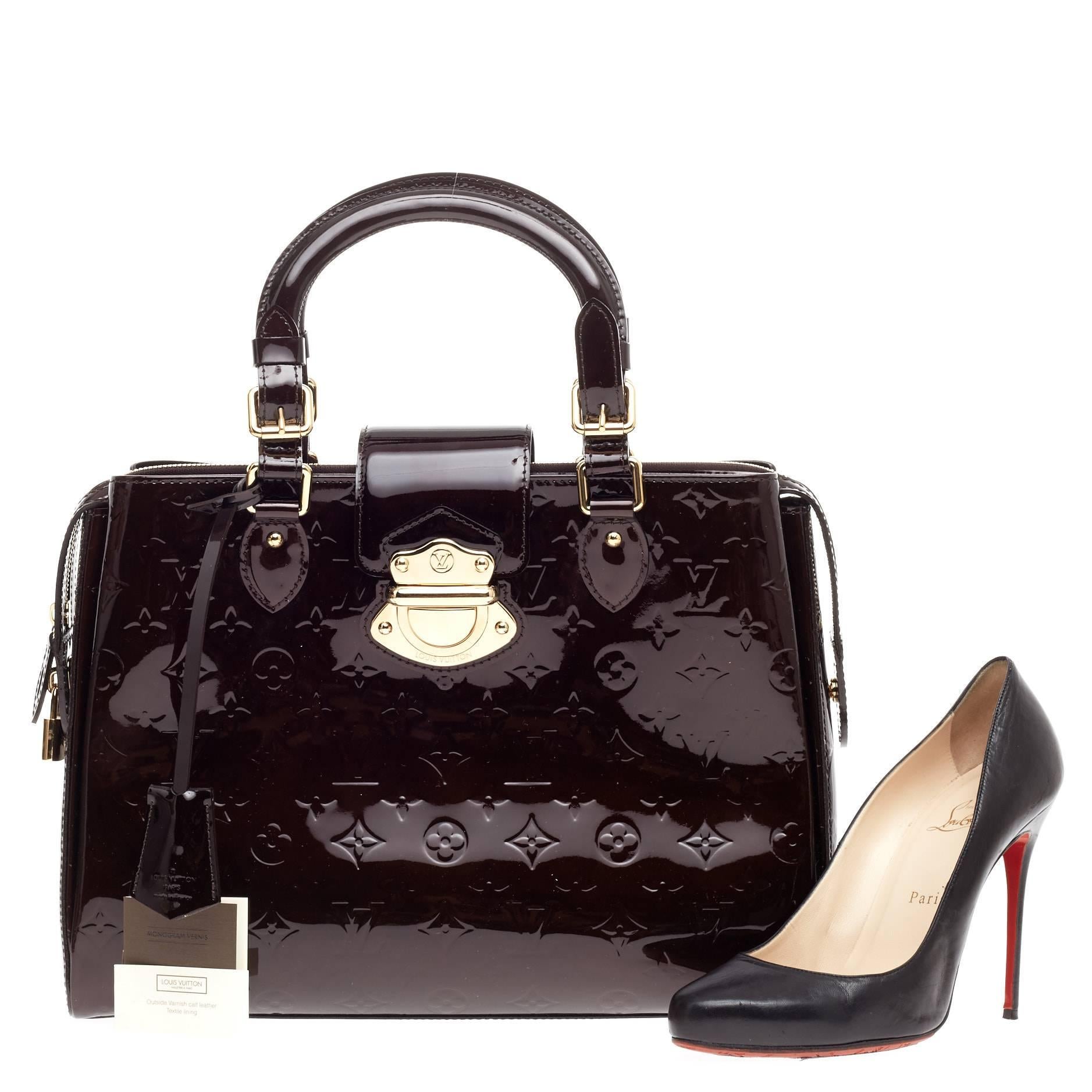This authentic Louis Vuitton Melrose Avenue Monogram Vernis is a fresh and elegant spin on a classic style that is perfect for any outfit. Crafted from Louis Vuitton's glossy vernis patent leather in stunning amarante purple, this stylish and