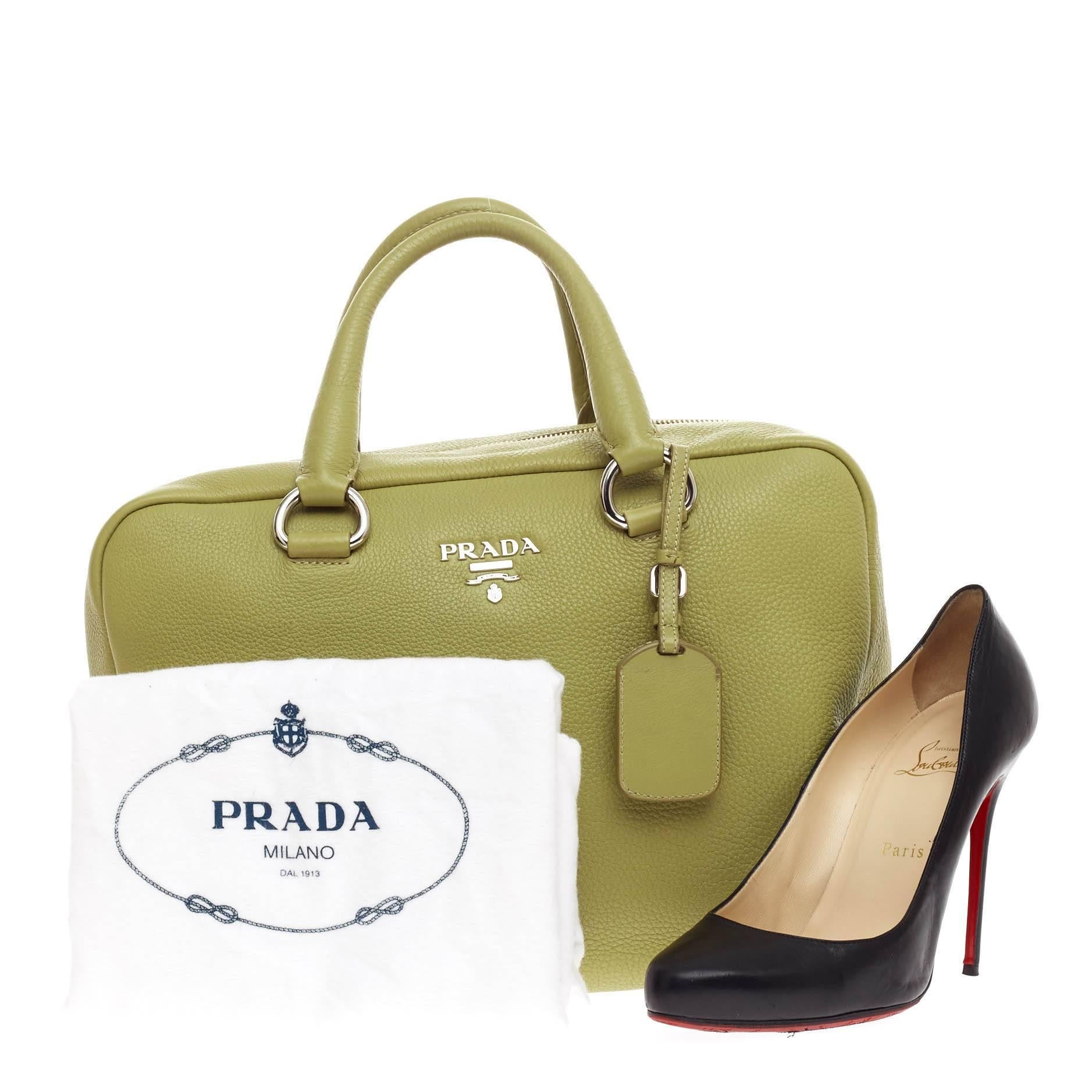 This authentic Prada Bauletto Vitello Daino Medium is your perfect everyday bag. Crafted in lime green vitello daino leather, this fresh, modern bag features dual-rolled leather handles, Prada logo at the center, protective base studs and