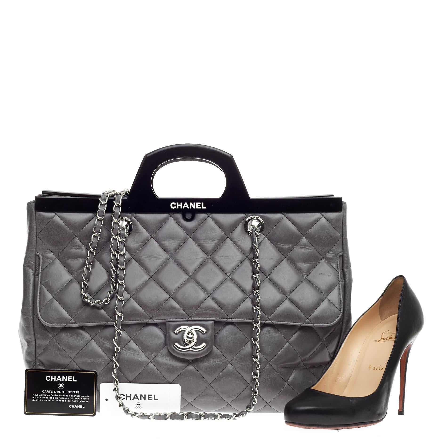 This authentic Chanel CC Delivery Tote Quilted Glazed Calfskin Large presented in the brand's Fall/Winter 2014 Act II Collection mixes classic Chanel styling with a modern, fresh twist. Crafted from grey quilted calfskin, this oversized school-style