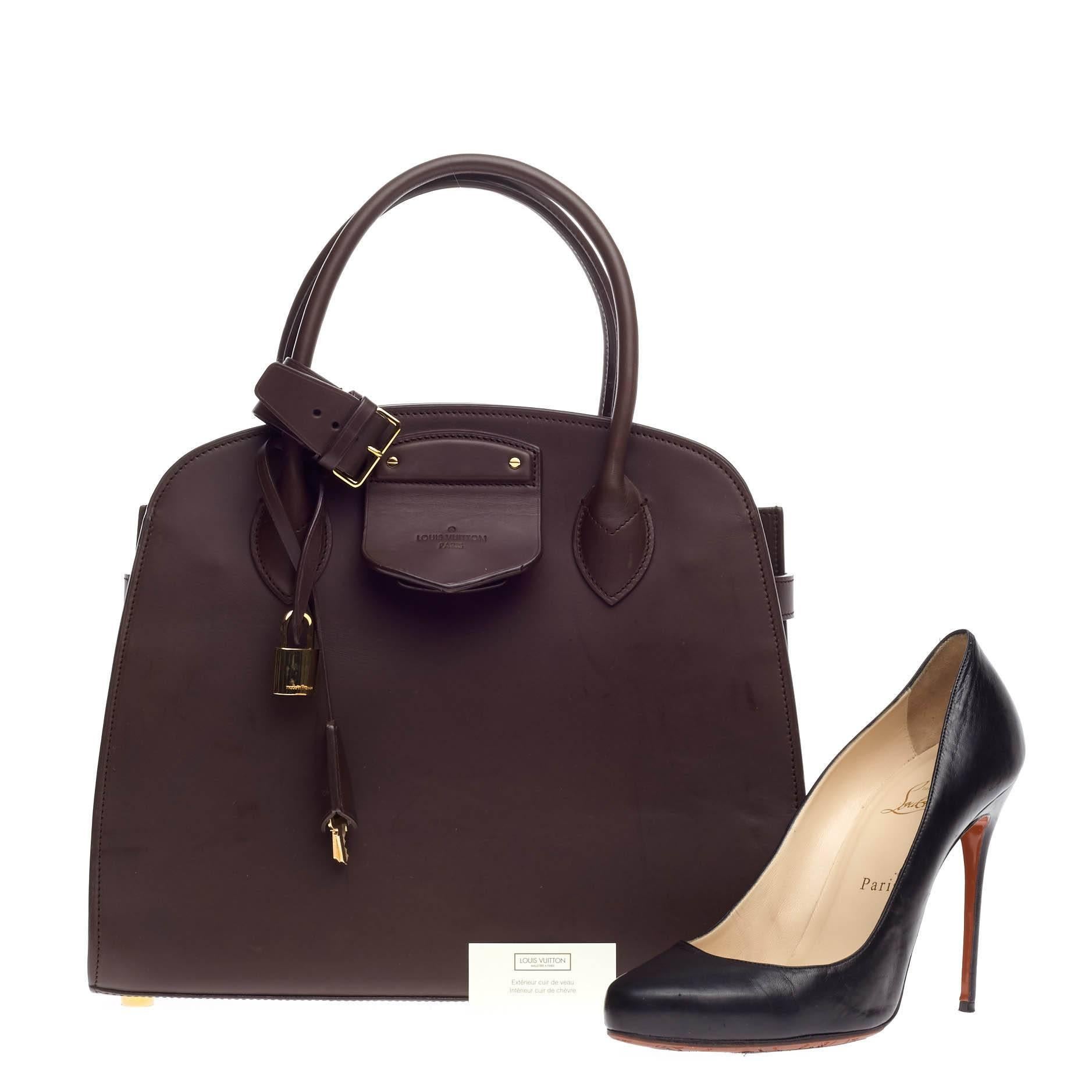 This authentic Louis Vuitton Haute Maroquinerie Neo Steamer Leather is from the brand's bespoke line of customized bags is elegant and classic as they come. Constructed from dark maroon leather, this exclusive satchel features dual-rolled handles