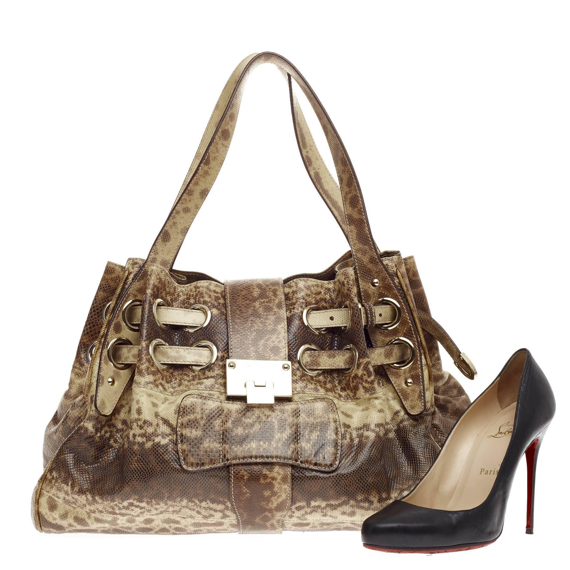 This authentic Jimmy Choo Ramona Hobo Snakeskin is sophisticated and easy-to-carry made for everyday excursions. Constructed from natural brown and yellow genuine snakeskin, this hobo features multiple wrapped slim leather straps laced through metal