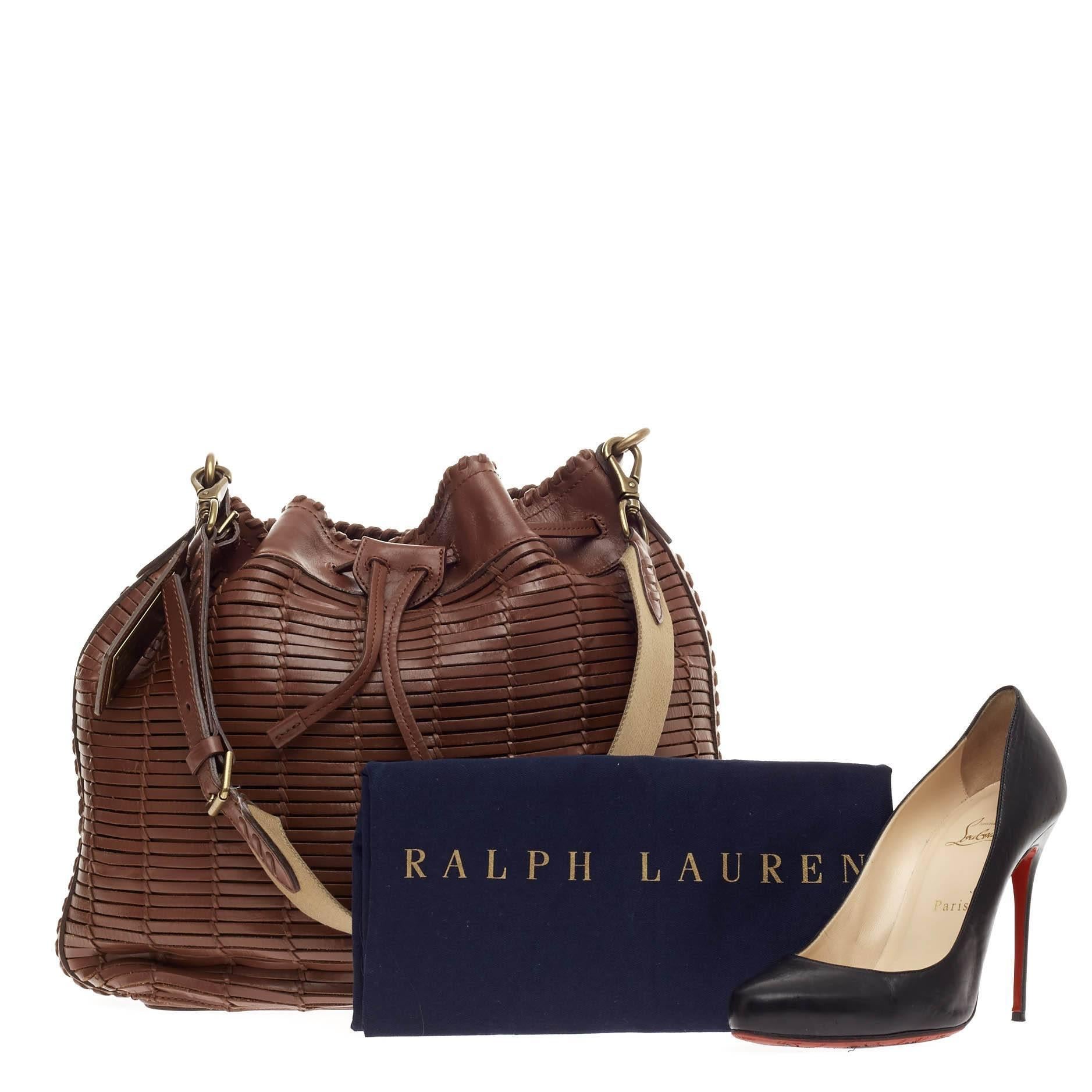 This authentic Ralph Lauren Drawstring Shoulder Bag Pleated Leather Large is a stylish casual everyday bag perfect for fashionistas. Crafted in brown window-style pleated leather, this industrial bucket bag features an adjustable shoulder strap,