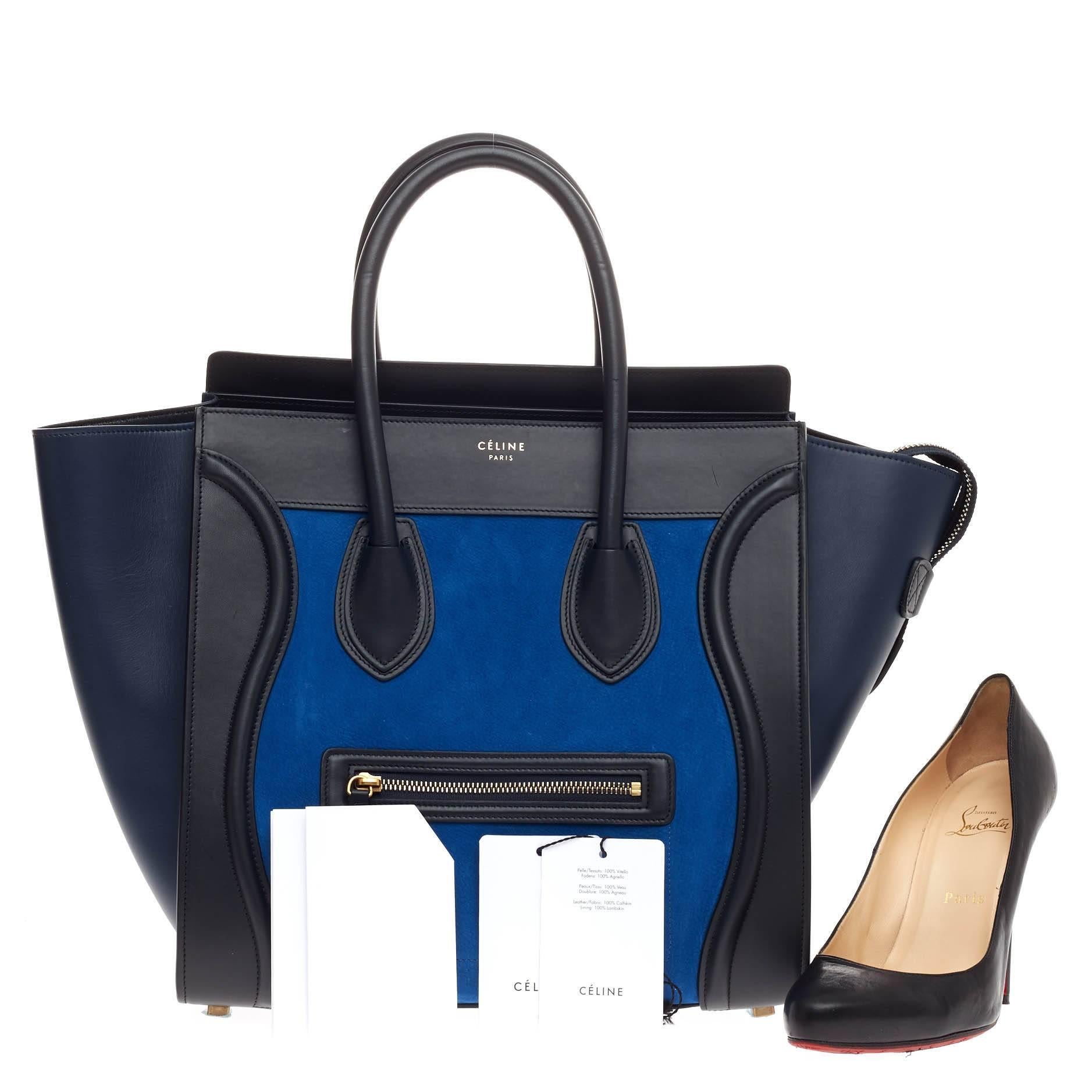 This authentic Celine Tricolor Luggage Nubuck Mini presented in the brand's Fall/Winter 2014 Collection showcases an elegant day-to-day style essential for any fashionista. Constructed with tricolor shades of black and navy blue leather with a