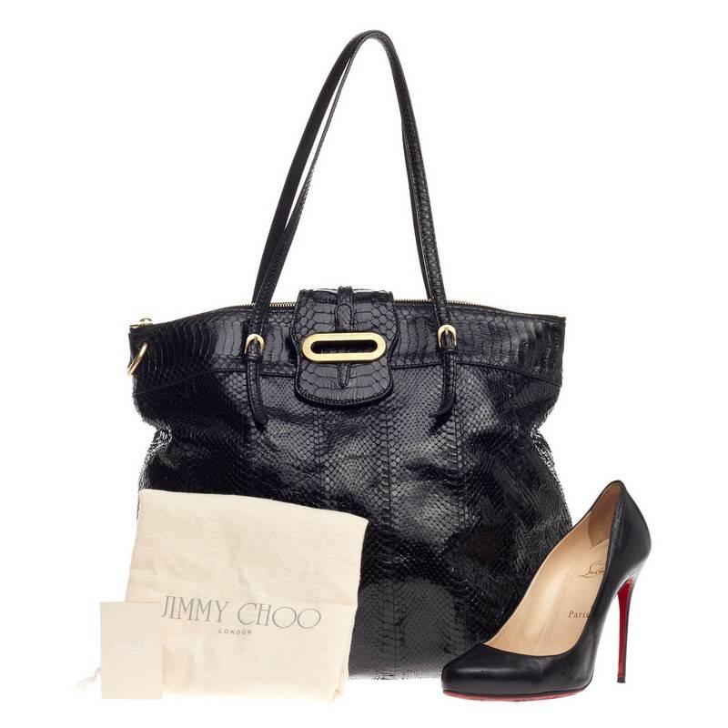 This authentic Jimmy Choo Tilda Tote Python adds a refined touch that works well with both casual and dressier styles. Crafted from glossy black genuine python skin, this tote features slim straps, flap detail with Jimmy Choo logo-engraved ring,