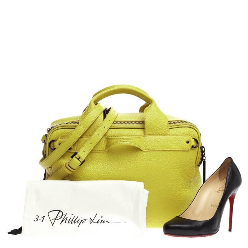 This authentic 3.1 Phillip Lim Lark Duffle Leather Small is a modern minimalist everyday bag for the modern woman. Crafted from stand-out lemon yellow leather, this edgy bag features dual flat top handles, adjustable zip gussets at the sides, small
