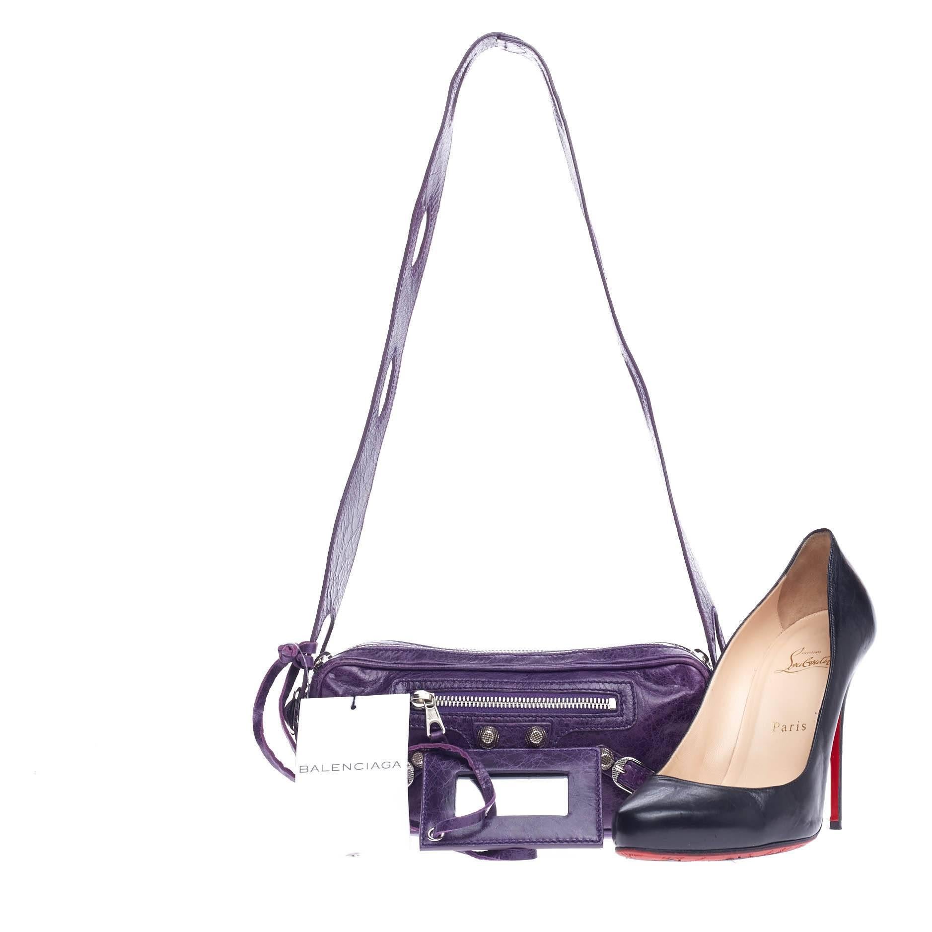 This authentic Balenciaga Chic Giant Studs Leather Small presented in the brand's Fall 2008 Collection is an edgy everyday bag made for fashionistas. Crafted from sapphire purple lambskin leather, this bag features a flat leather strap with