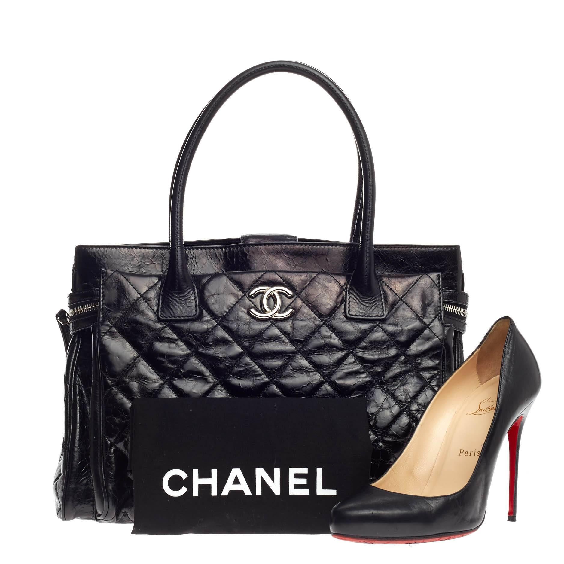 This authentic Chanel Executive Tote Quilted Glazed Calfskin Large is an ideal everyday accessory for the modern woman. Crafted from beautiful, black quilted glazed calfskin leather, this classic and functional tote features dual-rolled tall