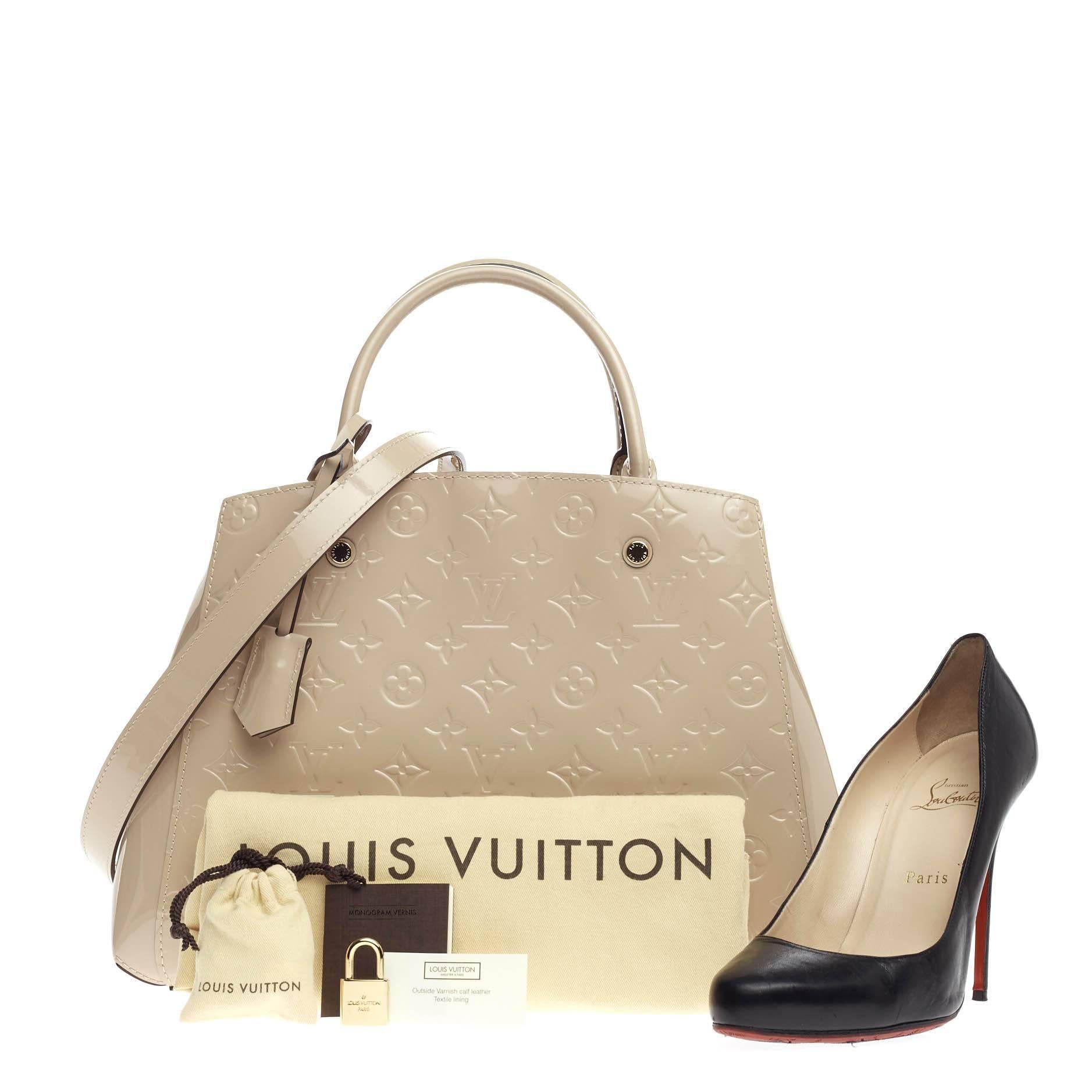 This authentic Louis Vuitton Montaigne Monogram Vernis MM named after the famed Parisian location is as sophisticated as it is sturdy. Crafted from dune monogram vernis, this bag features dual-rolled handles, detachable shoulder strap, black leather