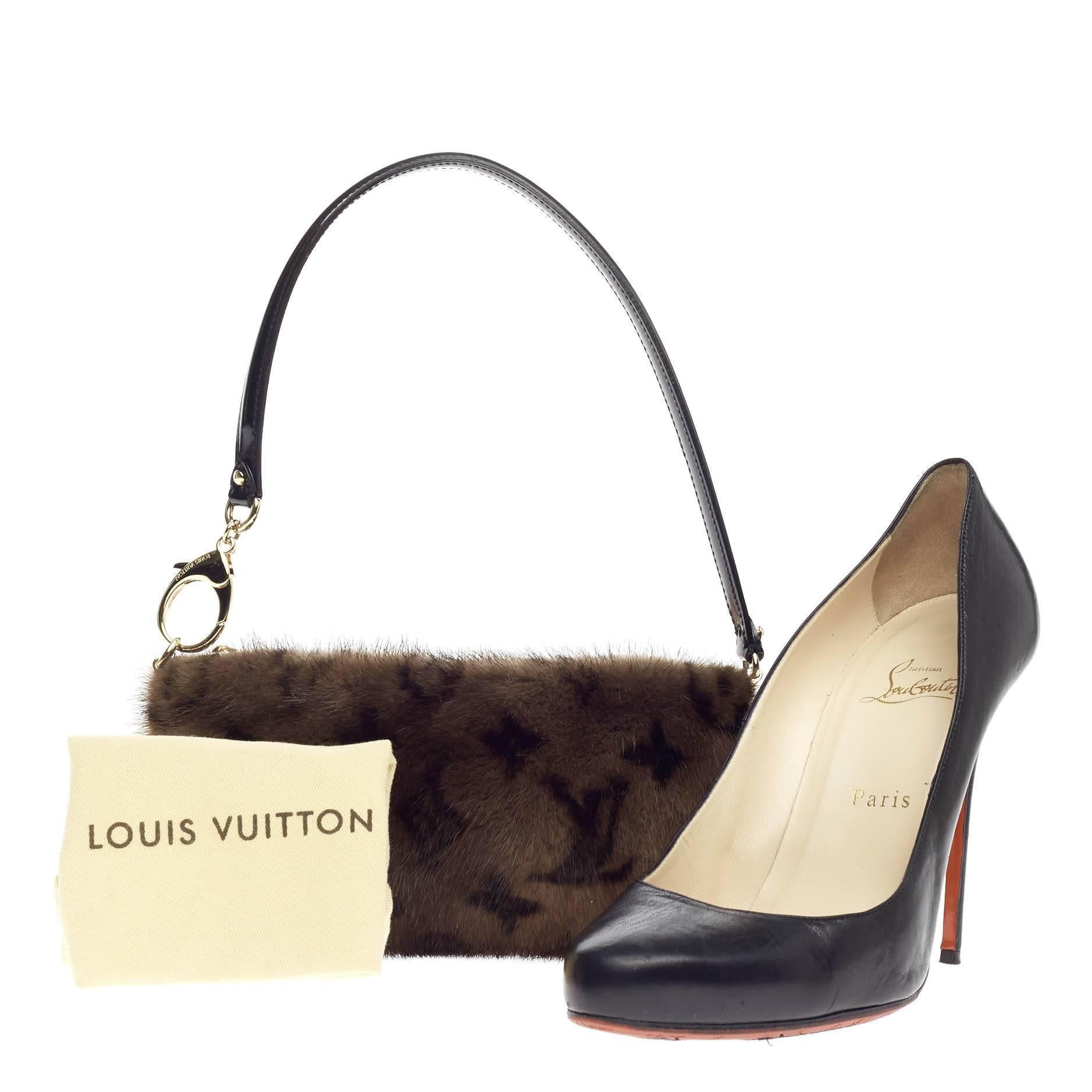 This authentic Louis Vuitton Milla Pochette Vision Mink MM released in 2009 aptly named after the actress Milla Jovovich is an excellent and chic accessory to carry around during night outs. Crafted from luxurious brown monogram print on genuine