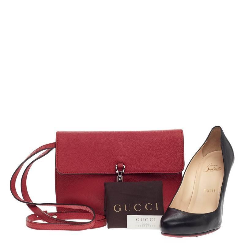 This authentic Gucci Jackie Soft Convertible Clutch Leather Mini from the brand's 2014 Collection mixes the brand's traditional, luxurious design with a modern twist perfect for the on-the-go woman. Crafted from beautiful red soft leather, this
