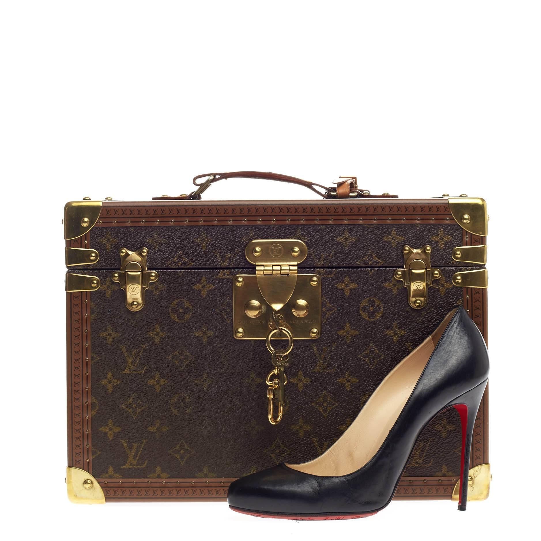 This authentic Louis Vuitton Boite Pharmacie Monogram Canvas is an outstanding, timeless collector's piece that is versatile and draws all the attention. Crafted from brown monogram coated canvas, this hard-to-find case features a flat top handle,