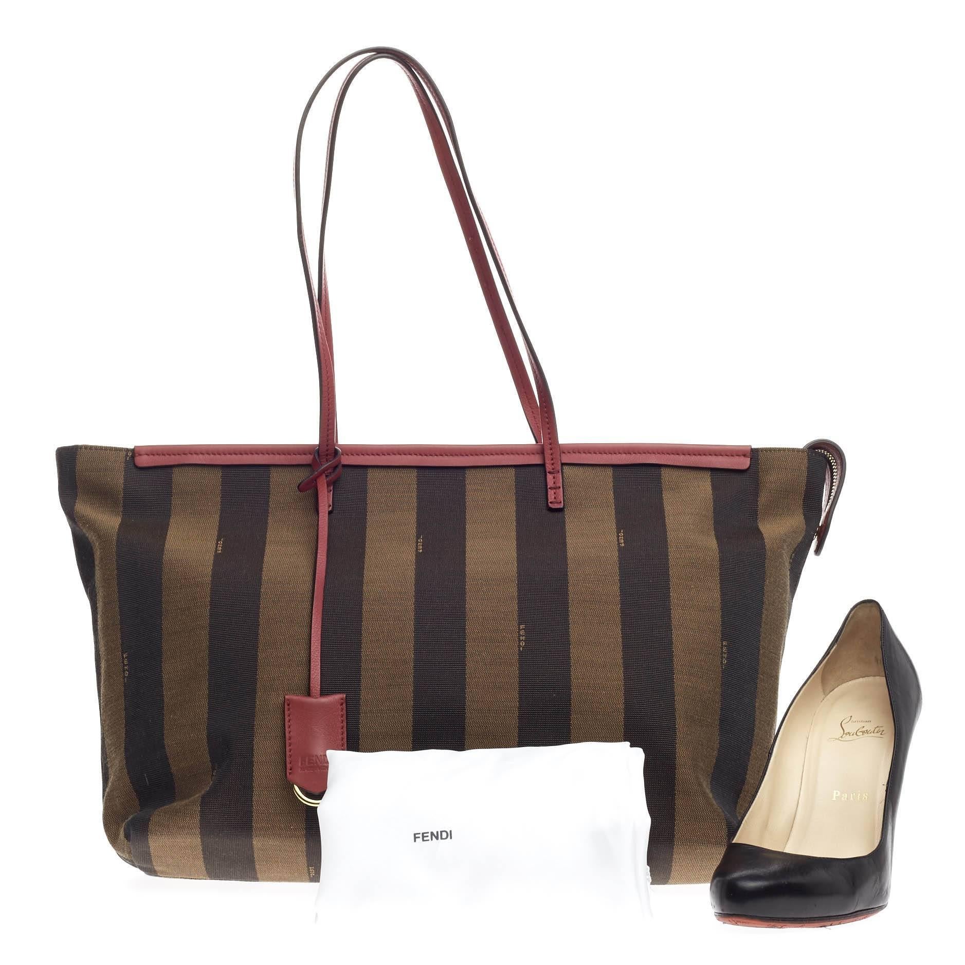This authentic Fendi Pequin Roll Tote Canvas Large is simple and classic ideal for everyday use. Crafted from brown pequin-striped fabric with pink leather trims, this tote features tall flat handles, hanging key charm and gold-tone hardware