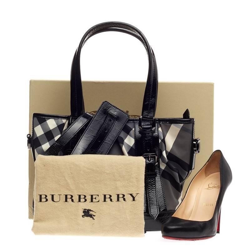 This authentic Burberry Lowry Convertible Tote Beat Check Nylon Medium is casual yet sophisticated in design perfect for everyday use. Crafted from the brand's white, grey and black beat check nylon, this subtly pleated tote features distressed
