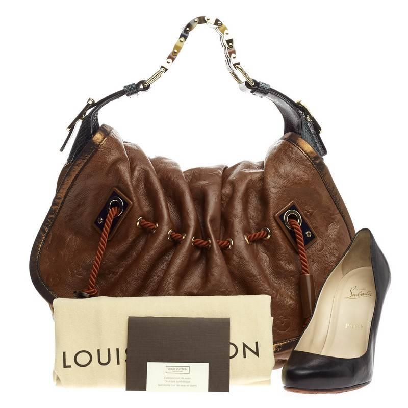 This authentic Louis Vuitton Kalahari Limited Edition Monogram Epices GM presented in the brand's Spring/Summer 2009 Collection aptly named after the beautiful sub-saharan african desert mixes traditional styling with luxurious ethnic motif. Crafted