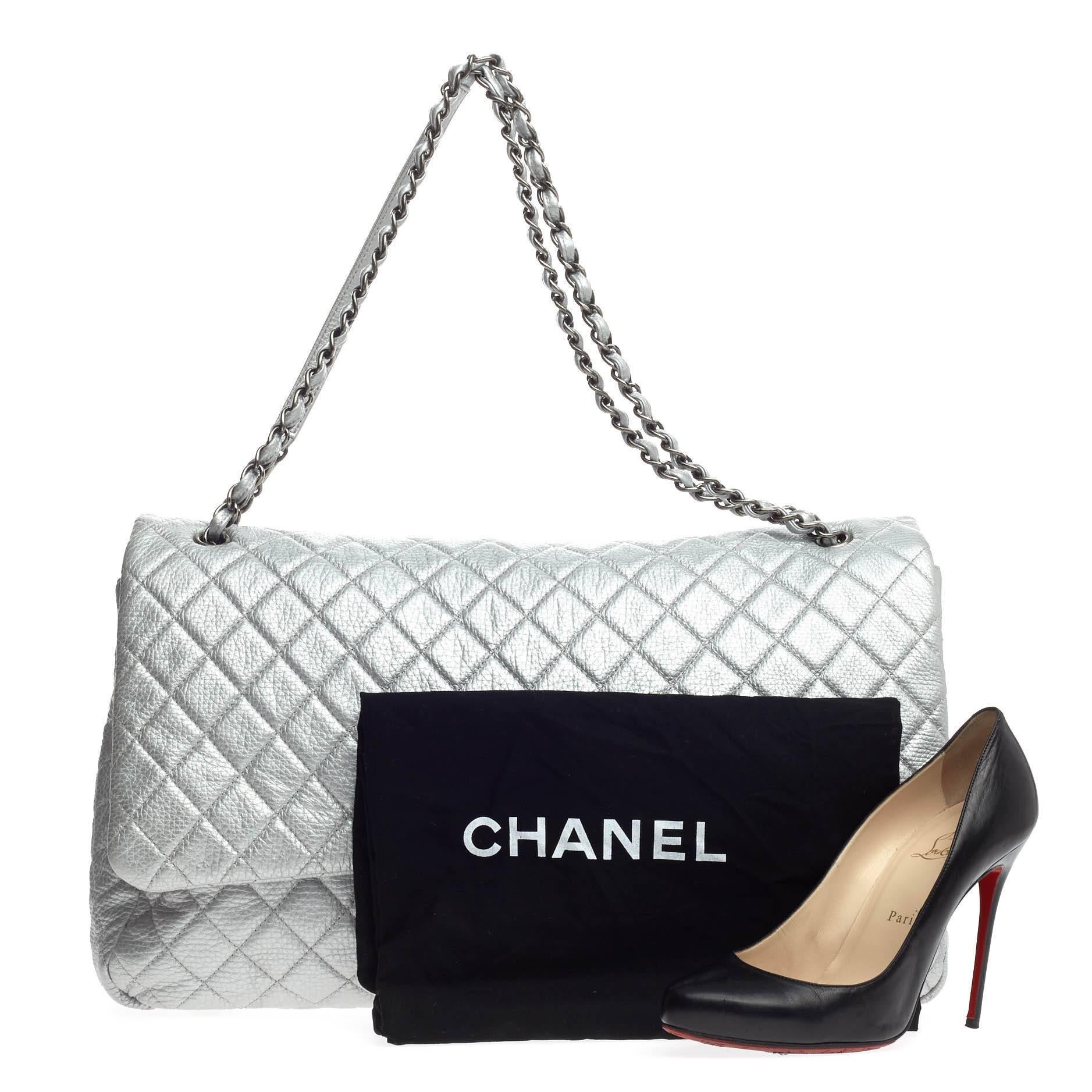 This authentic Chanel Airlines CC Flap Quilted Calfskin XXL presented in Chanel Spring/Summer 2016 Act 2 Collection is an oversized travel beauty made for all Chanel lovers. Crafted in metallic silver in its signature diamond quilted design, this