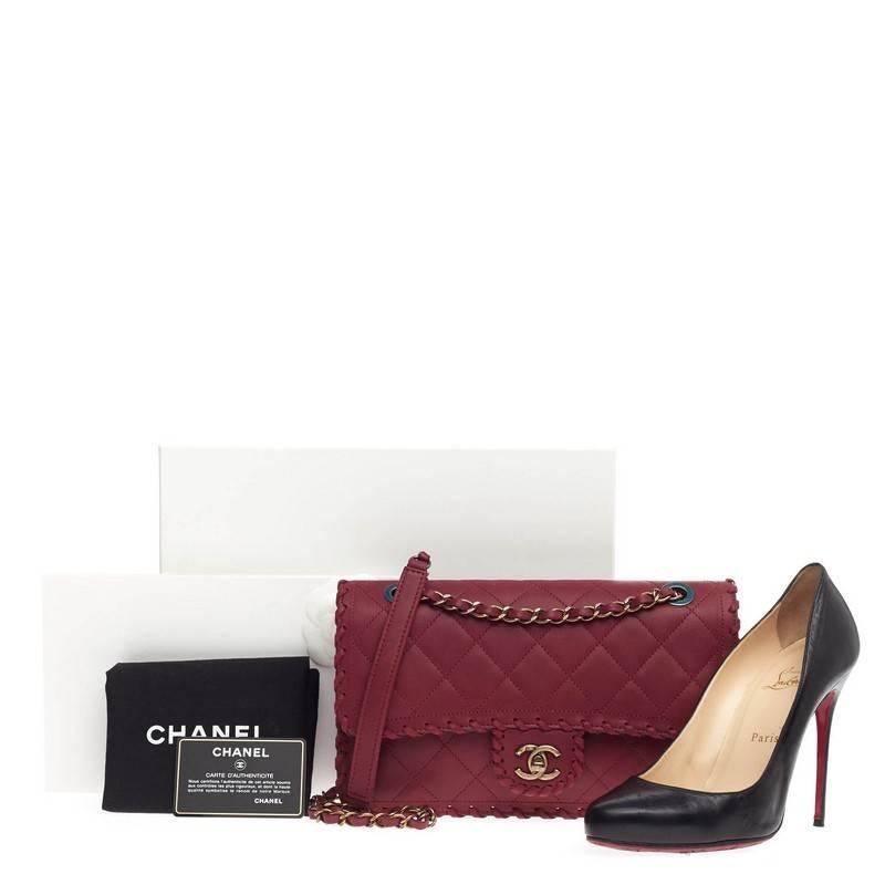 This authentic Chanel Whipstitch Flap Quilted Velvet Calfskin Medium from the brand's Spring 2015 is a modern, romantic essential made for any modern woman. Crafted in wine quilted velvet calfskin leather, this updated flap features woven-in leather