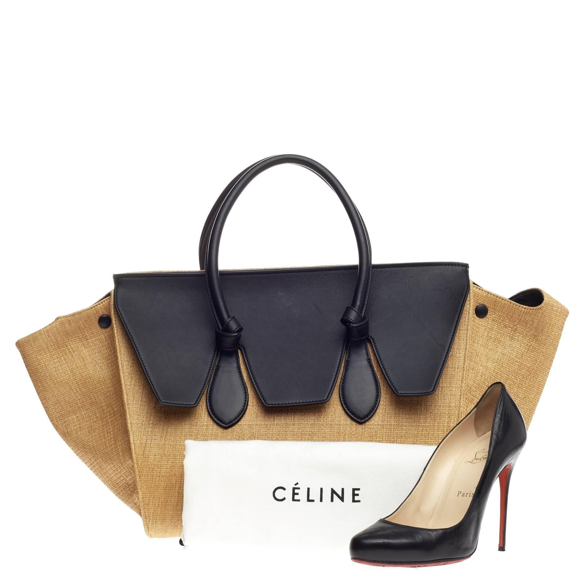This authentic Celine Tie Tote Raffia and Leather Small is an absolute must-have for serious fashionistas. Crafted from sturdy mustard yellow raffia and black leather, this boxy, casual-chic tote features dual-rolled leather handles with signature