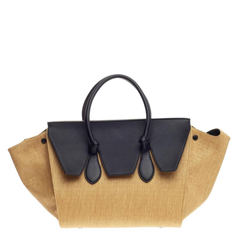 CELINE VINTAGE TOTE, monogrammed cloth with raffia and double cord closure,  fabric lining with dust bag, 35cm x 37cm H and another monogrammed black  cloth with leather trims and handle, with dust
