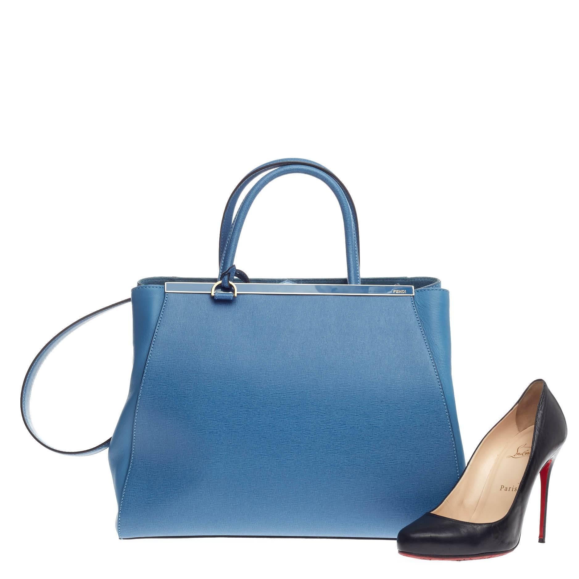This authentic Fendi 2Jours Leather Medium is impeccably stylish simple silhouette and structured design. Finely crafted in sturdy sky blue leather with soft calfskin sides, this popular tote features a shining top bar that dons the Fendi brand