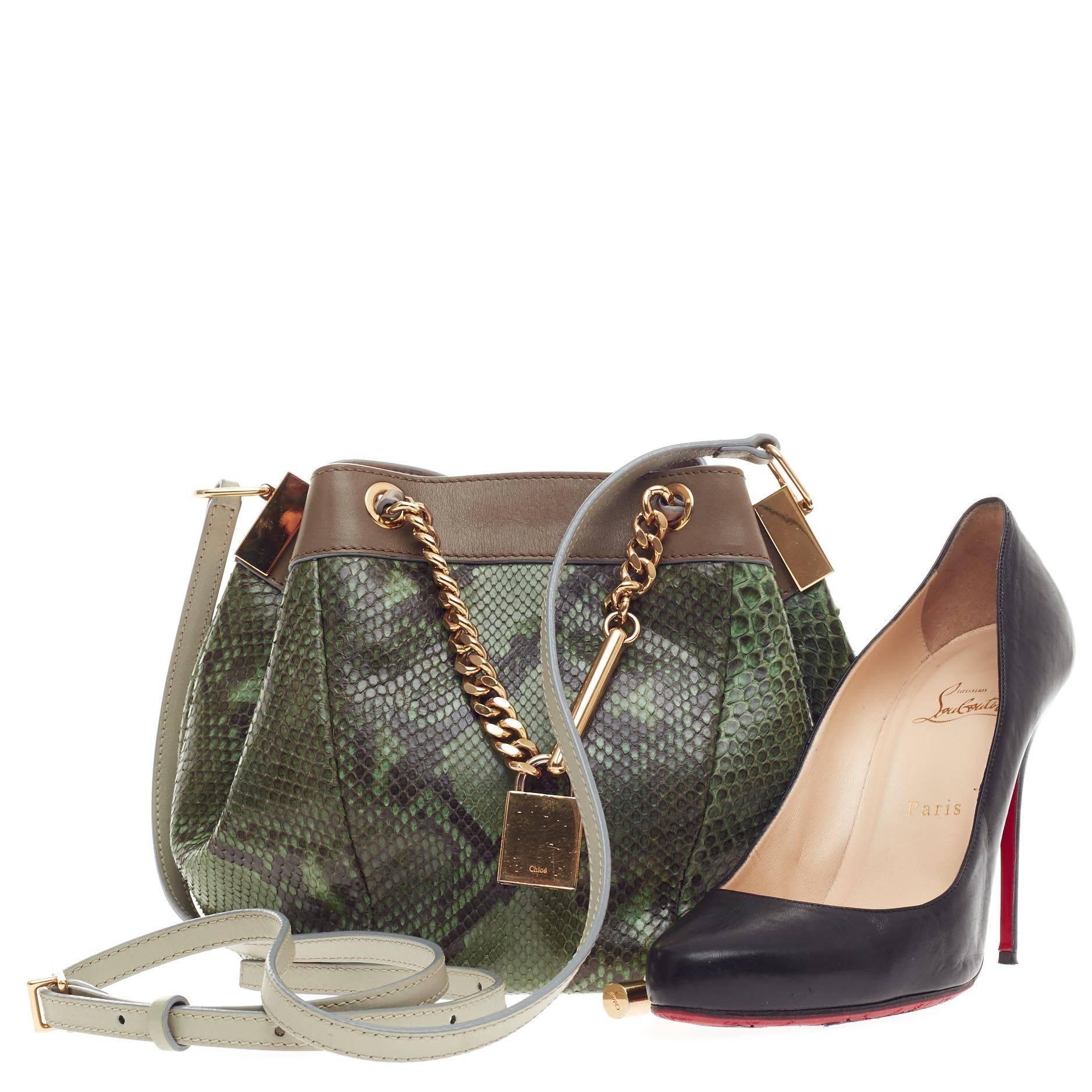 This authentic Chloe Camille Crossbody Python Small presented in the brand's Spring/Summer 2014 Collection showcases modern luxury with its innovative and youthful design. Exquisitely made from genuine forest green python skin, this petite crossbody