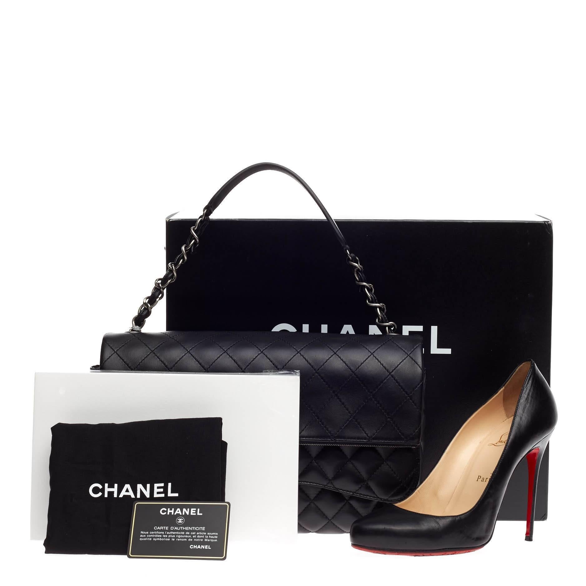 This authentic Chanel Chain Double Flap Bag Quilted Lambskin Large presented in the brand's 2015 Collection exudes a classic yet easy style made for the modern woman. Crafted from supple black lambskin leather, this elegant flap features Chanel's