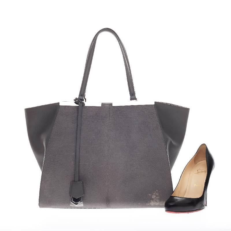 This authentic Fendi 3Jours Crocodile Print Pony Hair Large updated from its popular predecessor the 2Jour tote is impeccably stylish. Crafted in soft dark gray pony hair with leather wings, this minimalist tote features a subtle crocodile print, a