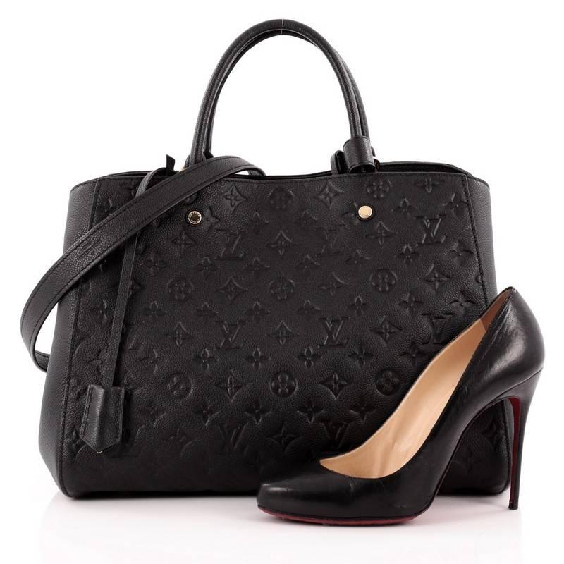 This authentic Louis Vuitton Montaigne Monogram Empreinte Leather GM named after the famed Parisian location is as sophisticated as it is sturdy. Crafted in classic black embossed monogram empreinte leather, this luxurious and refined bag features