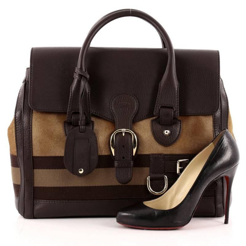 This authentic Gucci Heritage Web Boston Pony Hair and Leather Large mixes equestrian-inspired styling, with a luxurious spin made for modern fashionistas. Crafted from brown pony hair and leather with signature web detailing, this tote features