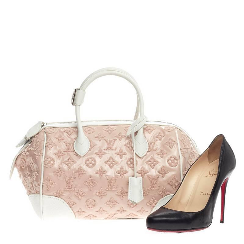 This authentic Louis Vuitton Round Speedy Monogram Bouclettes in rose pastel pink is great for everyday wear and perfect for spring season. Crafted in patent lambskin in  embroidered monogram pattern and white calfskin trimmings, this Spring/Summer