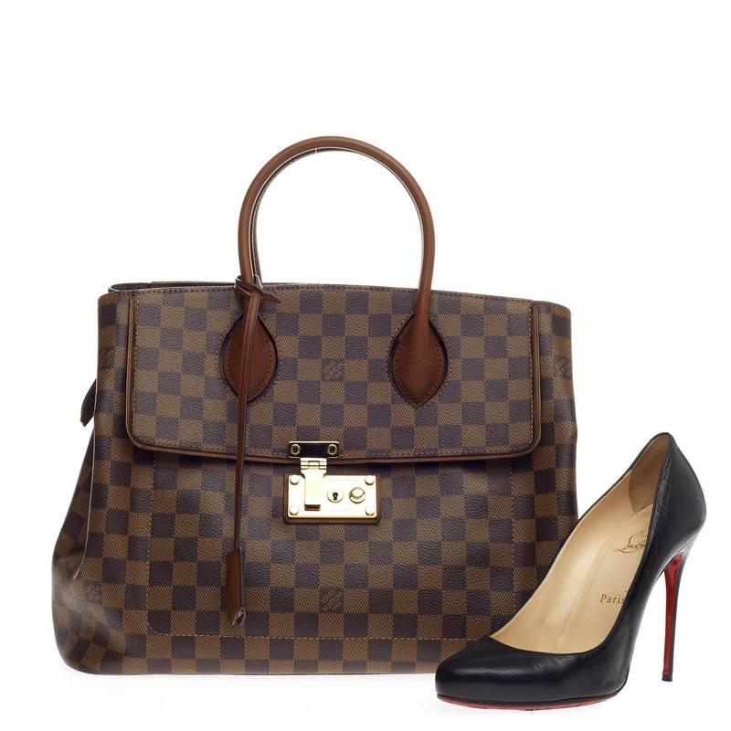 This authentic Louis Vuitton Ascot Damier s sophisticated and extremely functional made for everyday use or light traveling. Crafted from damier ebene with nomade calf leather trims, this structured tote features dual-rolled leather handles,