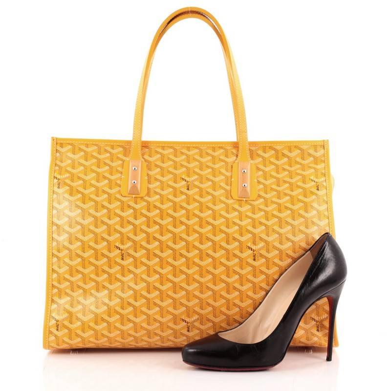 This authentic Goyard Marquises Coated Canvas is a luxurious and timeless tote personifying the brand's iconic style made for everyday excursions. Crafted from yellow goyard chevron print, this chic, soft-structured tote features dual-flat leather