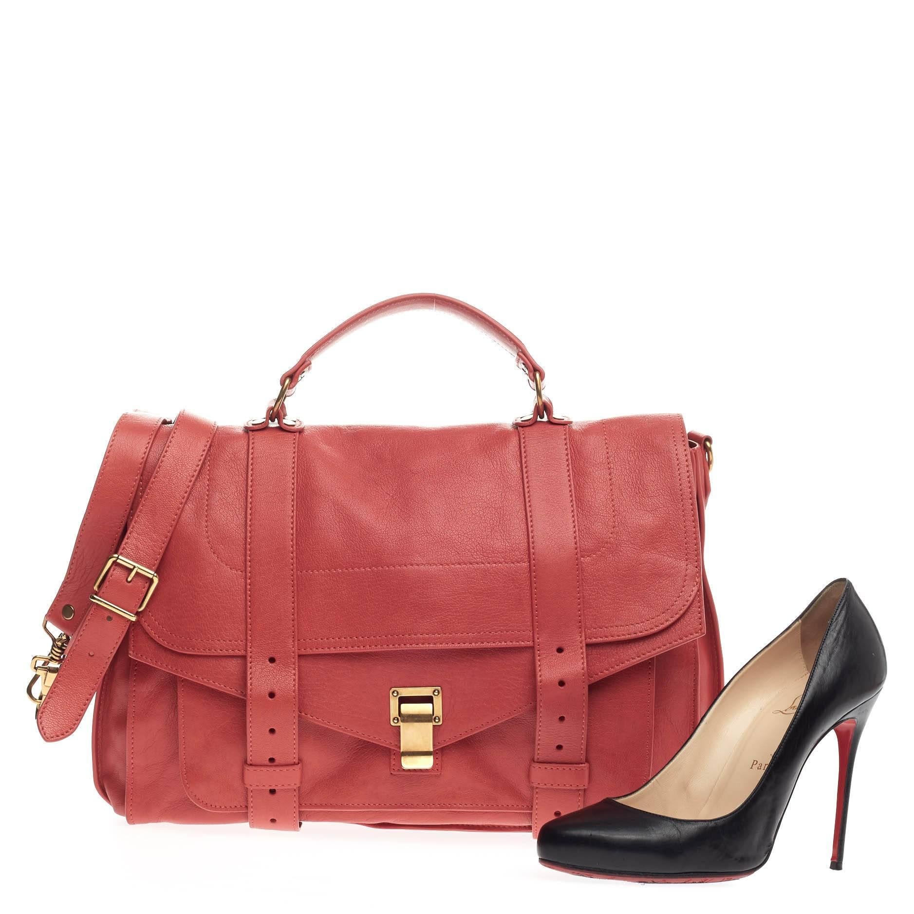 This authentic Proenza Schouler PS1 Satchel Leather Large is the ideal way to travel with style and functionality. Constructed from supple red leather, this popular satchel features an envelope-style front flap with two straps that slide through