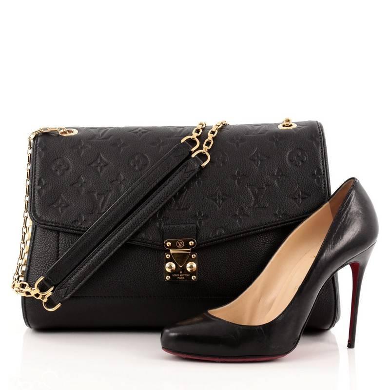 This authentic Louis Vuitton Saint Germain Monogram Empreinte Leather MM is described as “The Epitome of Elegant Practicality” with its stylish silhouette and feminine elegance. Featured in the brand's Fall/Winter 2014 Collection in classic black