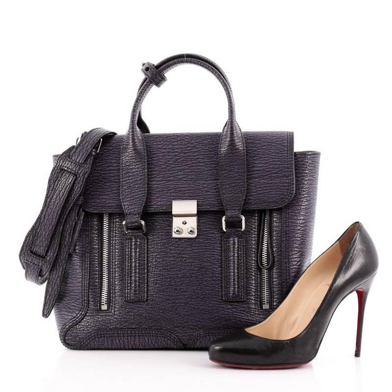 This authentic 3.1 Phillip Lim Pashli Satchel Leather Large is a practical bag with a stylish edge made for on-the-go moments. Crafted from purple leather with black under tones, this chic satchel features dual top handles, expandable zip sides, top