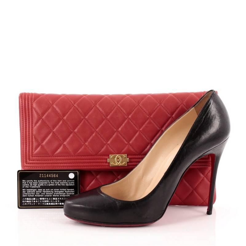 This authentic Chanel Boy Beauty CC Clutch Quilted Lambskin is a stylish clutch perfect for your everyday use. Crafted from supple red lambskin leather, this oversized, chic clutch features Chanel's famous diamond stitching, iconic Boy CC logo, zip