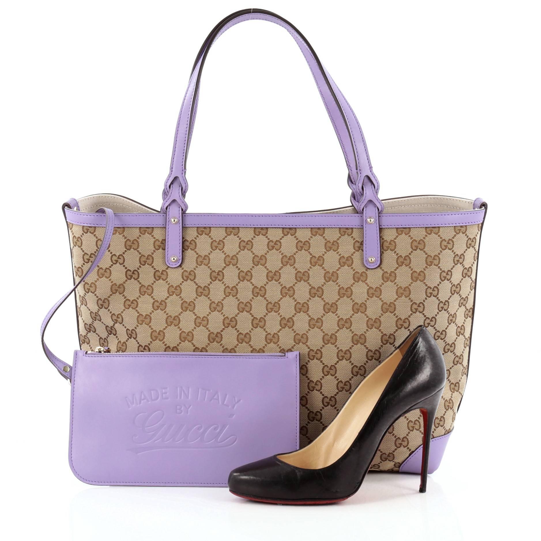 This authentic Gucci Craft Tote GG Canvas Medium is a chic tote ideal for everyday wear. Crafted from brown GG monogram canvas with purple leather trims, this roomy tote features dual-flat handles with braided ends, and light gold-tone hardware