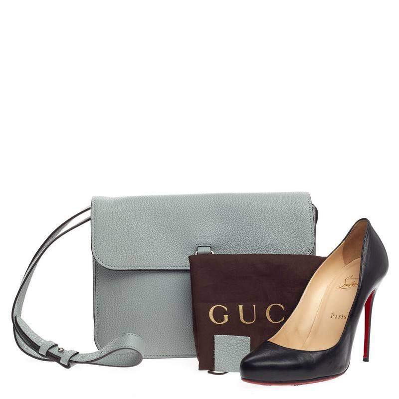 This authentic Gucci Jackie Flap Shoulder Bag Soft Leather from its 2014 Collection mixes the brand's traditional, luxurious design with a modern twist perfect for the on-the-go woman. Crafted from light blue leather with gray undertones, this small
