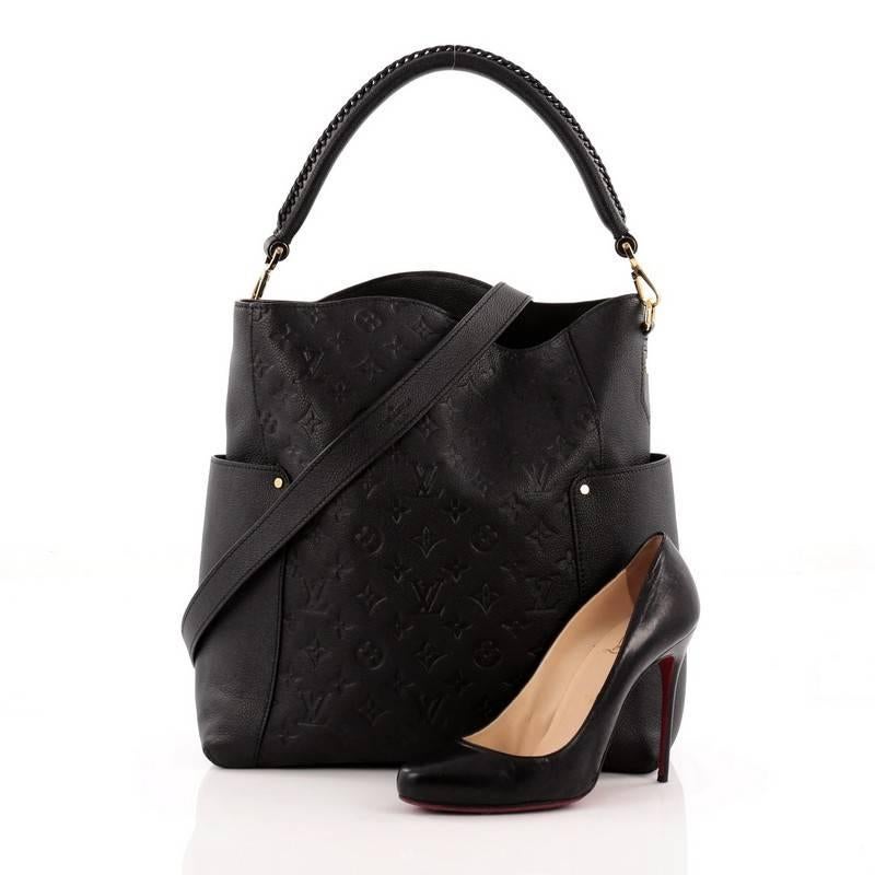 This authentic Louis Vuitton Bagatelle Hobo Monogram Empreinte Leather is a versatile and chic bag perfect for your everyday looks. Crafted from black monogram empreinte leather, this luxurious hobo features a braided handle, removable long shoulder