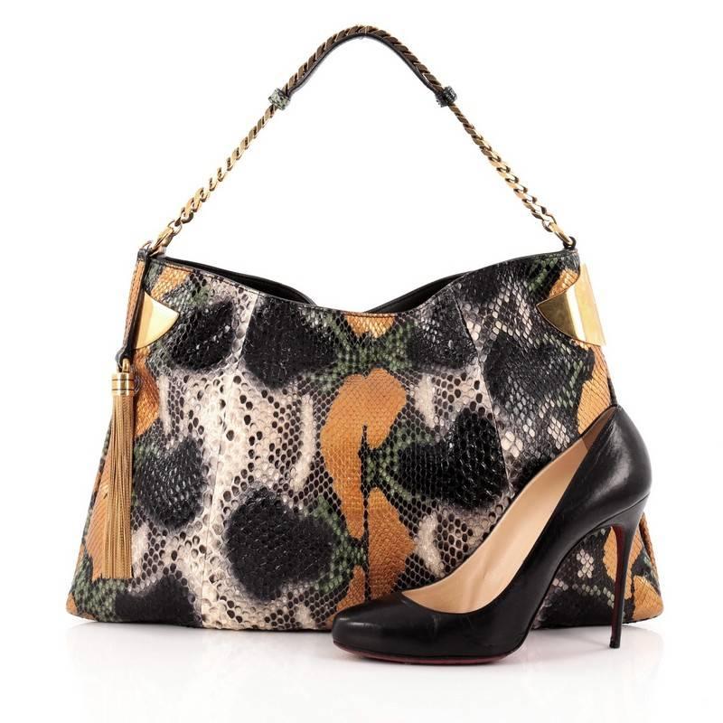 This authentic Gucci 1970 Hobo Python Large showcases a luxurious and alluring design made for modern fashionistas. Crafted from genuine eye-catching multicolored python skin, this exotic hobo features gold side cuff and tassel accents, chain-link