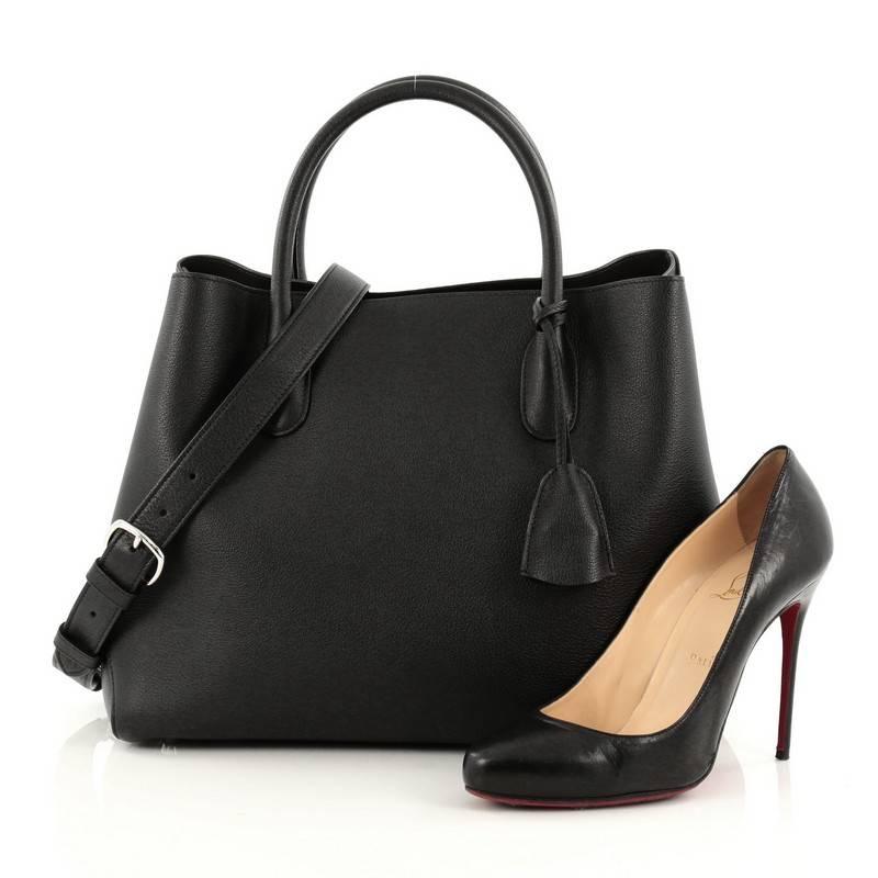 This authentic Christian Dior Open Bar Bag Leather Large takes inspiration from the brand's iconic Dior Bar jacket. Crafted in beautiful black leather, this impeccably chic tote features a clean and soft-structured design, dual-rolled handles,