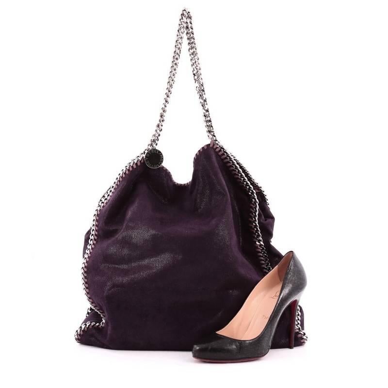 This authentic Stella McCartney Falabella Tote Shaggy Deer Large is perfect for casual day-to-day excursions. Crafted from purple shaggy deer, this no-fuss, lightweight tote features gunmetal chain link strap and trims, whipstitched edges, signature