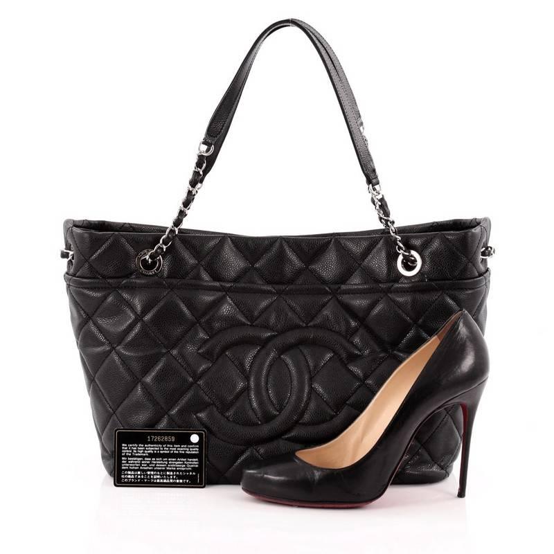 This authentic Chanel Timeless CC Soft Tote Quilted Caviar Large showcases the brand's classic style perfect for the modern woman. Crafted from black diamond quilted caviar leather, this stylish tote features Chanel's signature oversized stitched