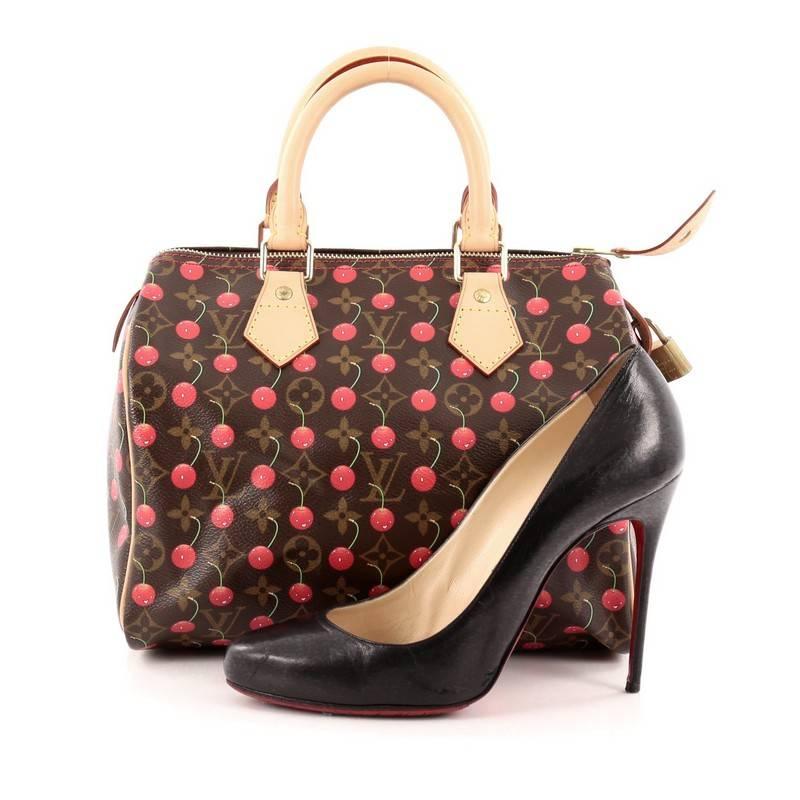 This authentic Louis Vuitton Speedy Handbag Limited Edition Cerises 25 is a coveted piece from the brand's Spring/Summer 2005 collection updating its classic Speedy design. Crafted from Louis Vuitton’s signature brown monogram coated canvas, this