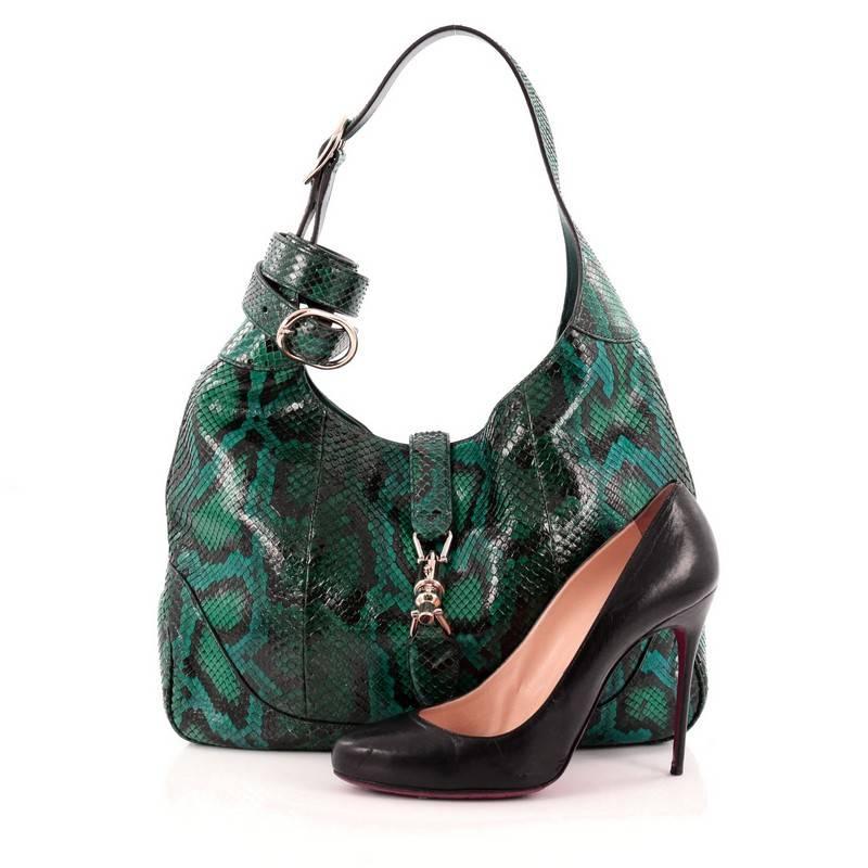 This authentic Gucci Jackie Original Shoulder Bag Python Medium is a must-have luxurious bag fit for the modern woman. Crafted from teal green genuine python skin, this re-imagined classic Jackie shoulder bag features an adjustable shoulder strap