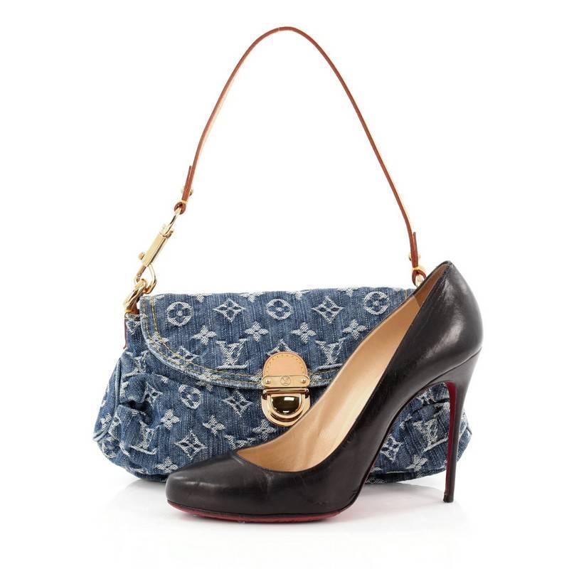 This authentic Louis Vuitton Pleaty Handbag Denim Mini is a fun and flirty bag from the brand's Monogram Denim collection. Crafted from stonewashed LV blue monogram denim, this mini shoulder bag features a removable vachetta leather handles allowing