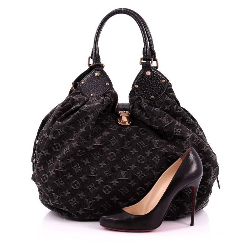 This authentic Louis Vuitton XL Hobo Denim is a contemporary take on a classic style which makes it perfect for a modern on-the-go fashionista. Crafted from black monogram denim, this hobo features an engraved push-lock hardware, dual-rolled