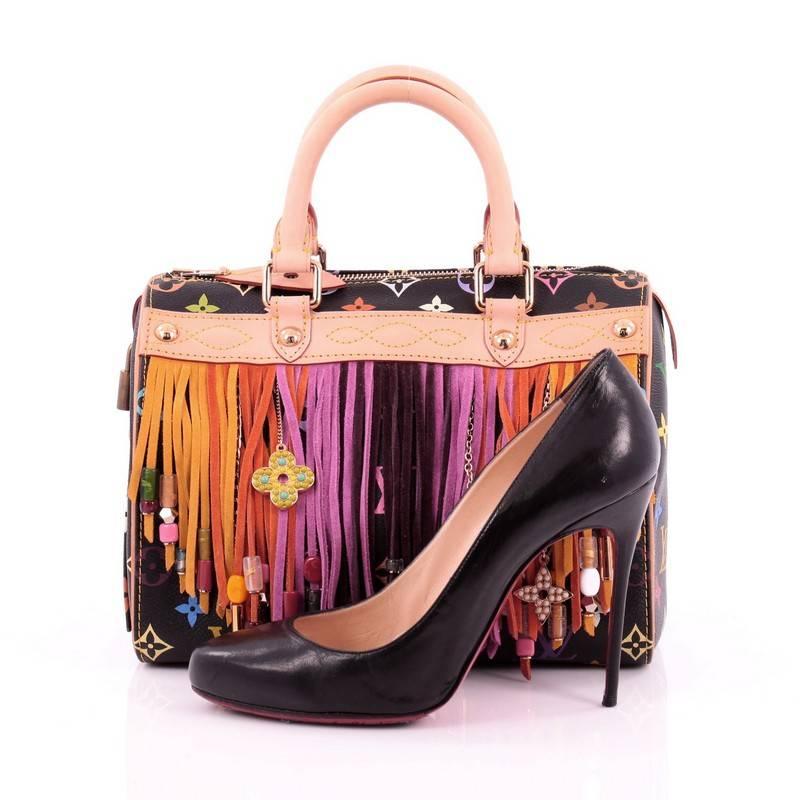 This authentic Louis Vuitton Speedy Handbag Limited Edition Multicolor Fringe 25 is one of Takashi Murakami's crowning jewels in the LV line and is a must-have for LV collectors. Constructed in Louis Vuitton's black multicolor monogram coated
