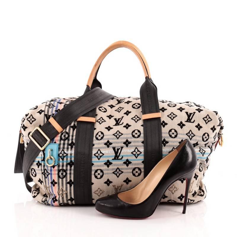 This authentic Louis Vuitton Cheche Tuareg Handbag Monogram Jacquard Fabric presented in the brand's Spring/Summer 2010 Collection is unique and playful in design ideal for free-spirited, chic fashionistas. Inspired by its distinct and refined